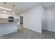 Modern kitchen with granite counters, stainless appliances, and pendant lighting at 14006 N Tumblebrook Way, Sun City, AZ 85351