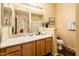 Bathroom with double vanity, large mirror, and walk-in shower at 14950 W Mountain View Blvd # 4103, Surprise, AZ 85374