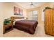 Cozy bedroom features a ceiling fan and plush carpeting at 14950 W Mountain View Blvd # 4103, Surprise, AZ 85374