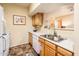 Well-lit kitchen features stainless steel sink and modern countertops at 14950 W Mountain View Blvd # 4103, Surprise, AZ 85374