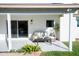 Inviting back patio featuring a neutral-toned sofa and coffee table, perfect for outdoor living at 15440 N 54Th St, Scottsdale, AZ 85254