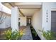 Inviting entryway with a pathway leading to the front door and tastefully landscaped garden at 15440 N 54Th St, Scottsdale, AZ 85254