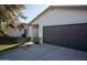 Exterior view of the house showcasing the two car garage and well-kept front yard at 15440 N 54Th St, Scottsdale, AZ 85254