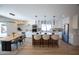 Modern kitchen featuring a center island with seating, stainless steel appliances, and sleek white cabinetry at 15440 N 54Th St, Scottsdale, AZ 85254