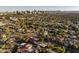 Panoramic aerial shot of a vibrant residential area with palm trees and views of the city skyline at 1614 Palmcroft Sw Dr, Phoenix, AZ 85007