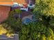 Backyard aerial view featuring the pool, spa, patio, and lush landscaping of this well-maintained property at 1614 Palmcroft Sw Dr, Phoenix, AZ 85007