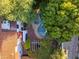 Backyard aerial view of this home with a kidney-shaped pool, hot tub, patio, and lots of shade trees at 1614 Palmcroft Sw Dr, Phoenix, AZ 85007