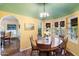 Bright dining area with bay windows, custom millwork, and room for dinner guests at 1614 Palmcroft Sw Dr, Phoenix, AZ 85007