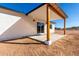 Covered back patio featuring wood support beams and a seamless transition to the outdoor space at 16560 N Slate Ln, Maricopa, AZ 85139