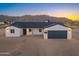 Beautiful single-story home features a two-car garage, desert landscaping and mountain views at 16560 N Slate Ln, Maricopa, AZ 85139