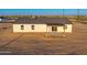 Aerial view of the rear exterior with a covered patio and access to the backyard at 16560 N Slate Ln, Maricopa, AZ 85139