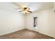 Comfortable bedroom featuring a ceiling fan and a sliding door to the outside at 17037 E El Pueblo Blvd, Fountain Hills, AZ 85268