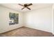 Bedroom with a view, featuring a large window letting in natural light and carpet at 17037 E El Pueblo Blvd, Fountain Hills, AZ 85268