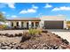 Charming single-story home with a brown tile roof and a two-car garage, surrounded by desert landscaping at 17037 E El Pueblo Blvd, Fountain Hills, AZ 85268