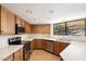 Well-lit kitchen with wood cabinets, stainless steel appliances, and ample counter space for meal preparation at 17037 E El Pueblo Blvd, Fountain Hills, AZ 85268