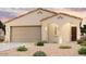 Charming single-story home with desert landscaping, a two-car garage, and an arched entryway at 1738 S 246Th Ln, Buckeye, AZ 85326