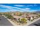 Beautiful suburban home with desert landscaping, set against a backdrop of scenic mountains and a clear blue sky at 17560 W Desert View Ln, Goodyear, AZ 85338