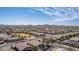 Expansive aerial view of the residential area with mountain views and well-maintained streets at 17560 W Desert View Ln, Goodyear, AZ 85338