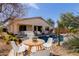 Backyard patio with outdoor seating, view of the private pool, and desert landscape at 17560 W Desert View Ln, Goodyear, AZ 85338