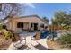 Beautiful backyard oasis featuring a sparkling pool, rock accents, and comfortable seating for outdoor enjoyment at 17560 W Desert View Ln, Goodyear, AZ 85338