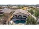 Aerial view of a single-story home showcasing a private backyard oasis with a refreshing pool at 17560 W Desert View Ln, Goodyear, AZ 85338