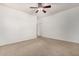 Bedroom with neutral walls, carpet, ceiling fan, and closet at 17560 W Desert View Ln, Goodyear, AZ 85338