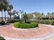 Beautiful view of community pool and lighthouse slide surrounded by palm trees and lush landscaping at 17560 W Desert View Ln, Goodyear, AZ 85338