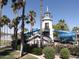 Community pool with lighthouse water slide offering fun for families in a tropical setting at 17560 W Desert View Ln, Goodyear, AZ 85338