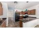 Kitchen features sleek countertops, stainless steel appliances and ample cabinet space at 17560 W Desert View Ln, Goodyear, AZ 85338