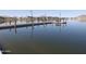 Scenic lake pier with benches, perfect for relaxing and enjoying waterfront views in a peaceful community setting at 17560 W Desert View Ln, Goodyear, AZ 85338