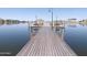 Close up of community pier with wooden planking and lake views, offering residents a scenic place for recreation at 17560 W Desert View Ln, Goodyear, AZ 85338