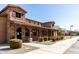 Charming office building featuring stone accents, purple shutters, and a welcoming covered entryway at 17577 W Desert Bloom St, Goodyear, AZ 85338