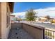 A cozy front entrance with stone accents, desert landscaping, and a secure gated entry at 17577 W Desert Bloom St, Goodyear, AZ 85338