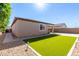 Green backyard featuring manicured artificial turf and landscaping at 17588 W Maricopa St, Goodyear, AZ 85338