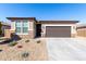 Charming single-story home with stone accents, desert landscaping, and a two-car garage at 17588 W Maricopa St, Goodyear, AZ 85338