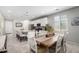 Open-concept kitchen with white cabinets, granite countertops, and a large center island at 17588 W Maricopa St, Goodyear, AZ 85338