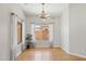 Bright dining room with hardwood floors, neutral paint, ceiling fan and natural light at 19595 N 107Th Dr, Sun City, AZ 85373