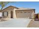 Charming single-story home featuring a two-car garage and desert landscaping at 19595 N 107Th Dr, Sun City, AZ 85373