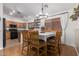 Dining room featuring wood floors and modern light fixture at 2106 E 39Th Ave, Apache Junction, AZ 85119