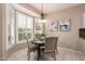 Charming dining area with a bay window that bathes the space in natural light at 21402 N 158Th Dr, Sun City West, AZ 85375