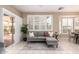 Relaxing living room area with sliding door access to the outdoor seating space at 21402 N 158Th Dr, Sun City West, AZ 85375