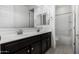 Bathroom with a double sink vanity, tile flooring and a view of the bath and toilet at 21978 N 97Th Dr, Peoria, AZ 85383