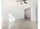 Bonus room featuring tile flooring, open entry, and natural light from an external window at 21978 N 97Th Dr, Peoria, AZ 85383