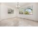 Dining room featuring bright natural light and views of the landscaped backyard at 21978 N 97Th Dr, Peoria, AZ 85383