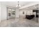 Dining room featuring a chandelier and an open concept leading to the kitchen at 21978 N 97Th Dr, Peoria, AZ 85383