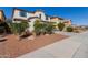 Lovely home with manicured shrubs in the front yard at 21978 N 97Th Dr, Peoria, AZ 85383