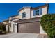 Beautiful home with a brown garage door at 21978 N 97Th Dr, Peoria, AZ 85383