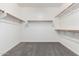 Spacious walk-in closet featuring multiple rods and shelves for optimal storage at 21978 N 97Th Dr, Peoria, AZ 85383