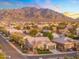 Scenic aerial view of a residential neighborhood with mountain views and tiled roofs at 2215 E La Costa Dr, Gilbert, AZ 85298