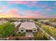 Aerial view of home with well-maintained landscaping, private yard, and beautiful sunset at 2215 E La Costa Dr, Gilbert, AZ 85298